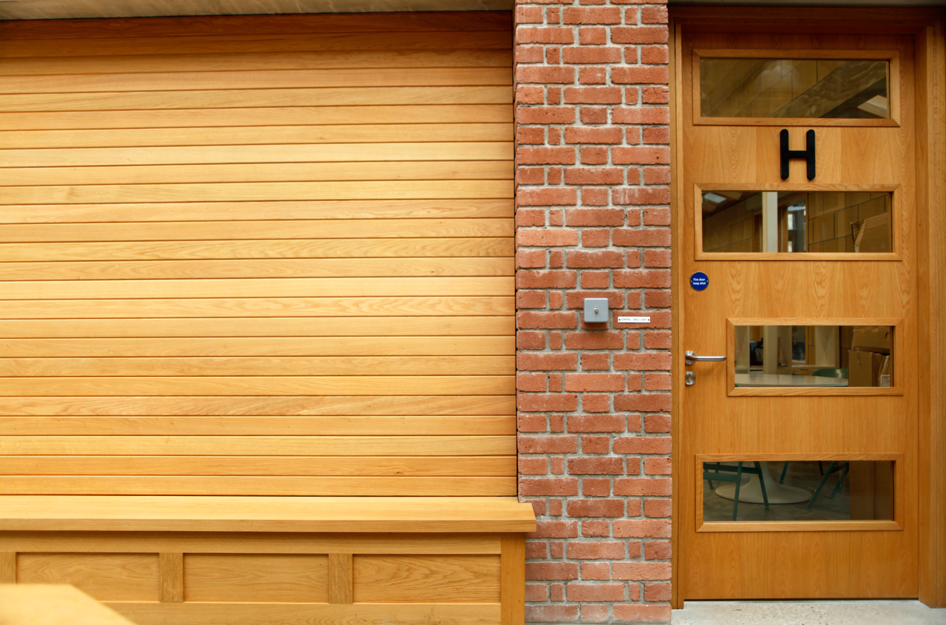 Oak panel with red brick in the central atrium of Jubilee Warehouse